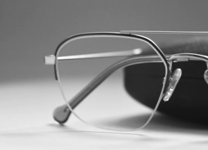 rimless blue light glasses laying on a table