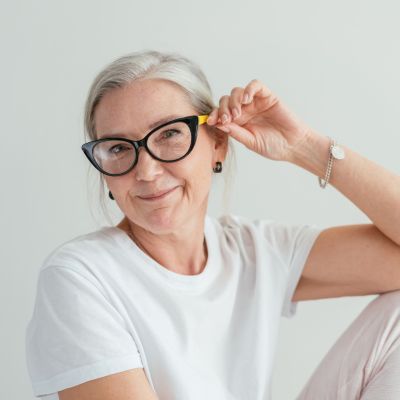 older woman wearing reading glasses