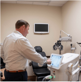 Eye doctor working on a machine