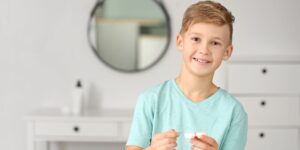 Little boy with contact lenses at home